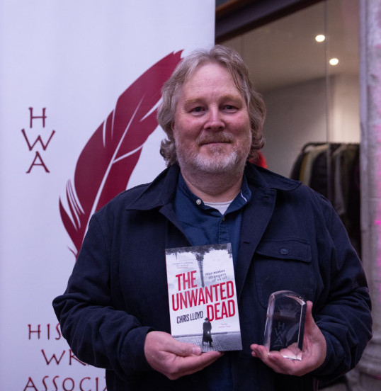 Photo of Chris with his award at the celebration in November, 2021: Fran Hales