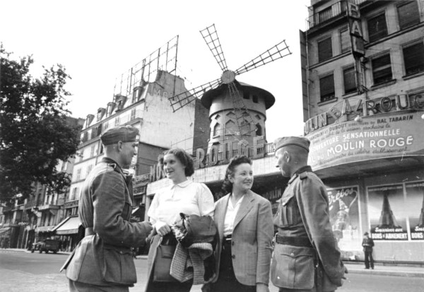 German soldiers with two women at the Moulin Rouge, June, 1940