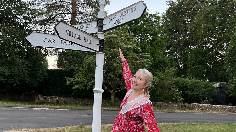 Jessica Bull at a signpost to Jane Austen's house