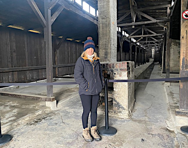 Kate at Auschwitz-Birkenau in a barrack similar to the one Renee was imprisoned in