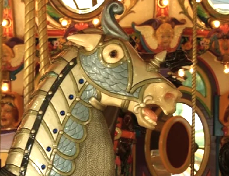 A merry go round with a horse on it.
